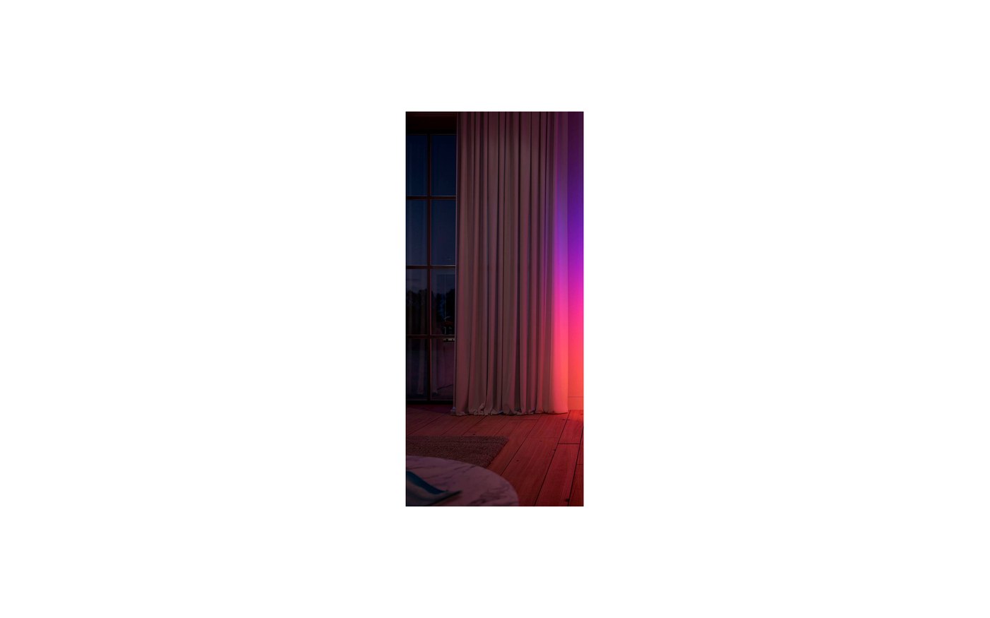 Philips Hue Signe Gradient floor lamp washing a wall in color